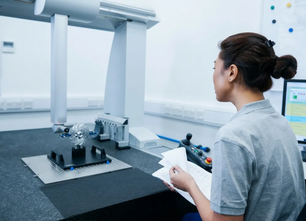 Inspector working at a coordinate measuring machine